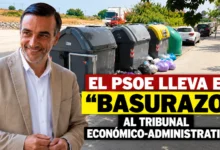 Primer plano de un contenedor gris de basura con una tapa deteriorada y señales de desgaste en su estructura.